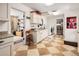 Mud and laundry room with tile floor, washer and dryer, and access to other rooms at 12941 W 75Th Ave, Arvada, CO 80005