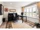 A well-lit home office boasts a bay window with seating, perfect for a comfortable workspace at 12941 W 75Th Ave, Arvada, CO 80005