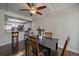 Charming dining area with hardwood floors open to the kitchen featuring an eat-in bar at 4896 S Dudley St # 5-5, Littleton, CO 80123