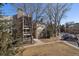 Exterior view of condo complex with stone chimneys and siding at 4896 S Dudley St # 5-5, Littleton, CO 80123