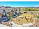 Neighborhood view featuring a playground, new homes and convenient street parking at 18284 E 49Th Pl, Denver, CO 80249