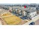 Aerial view of a new home, located near a playground with a grassy common area at 18284 E 49Th Pl, Denver, CO 80249