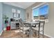 Well lit dining area featuring a modern table set and a stylish wine rack at 18284 E 49Th Pl, Denver, CO 80249