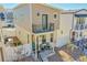 Modern home exterior featuring a small balcony, a well-kept yard, and clean lines at 18284 E 49Th Pl, Denver, CO 80249