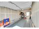 Spacious garage with ample storage space, and a door leading to the backyard at 18284 E 49Th Pl, Denver, CO 80249