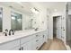 Bright bathroom with a double sink vanity and a glass walk-in shower at 39181 Anthony St, Elizabeth, CO 80107