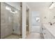 Bright bathroom featuring glass enclosed shower and double sink vanity at 39181 Anthony St, Elizabeth, CO 80107
