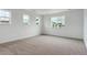 Spacious bedroom with neutral carpet and many windows that let in natural light at 39181 Anthony St, Elizabeth, CO 80107