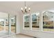 Bright dining area with sliding glass door and many windows at 39181 Anthony St, Elizabeth, CO 80107