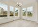 Bright dining area with large windows and a modern chandelier at 39181 Anthony St, Elizabeth, CO 80107