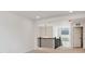 Hallway with staircase, railing, neutral carpet and chandelier lighting at 39181 Anthony St, Elizabeth, CO 80107