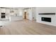 Spacious open-concept living room with hardwood floors, fireplace, and ample natural light at 39181 Anthony St, Elizabeth, CO 80107