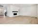 Bright living room with hardwood floors, built-in shelving, and contemporary fireplace at 39181 Anthony St, Elizabeth, CO 80107