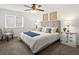 Serene bedroom featuring a comfortable bed, neutral tones, and a ceiling fan at 7700 W Glasgow Place # 15A, Littleton, CO 80128