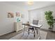 Inviting home office with light gray carpet, modern desk, white cabinet, and natural light at 7700 W Glasgow Place # 15A, Littleton, CO 80128