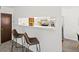 Open kitchen view with breakfast bar, stainless steel appliances, and ample counter space at 7700 W Glasgow Place # 15A, Littleton, CO 80128