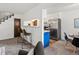 Open-concept kitchen and living area with breakfast bar and stainless steel appliances at 7700 W Glasgow Place # 15A, Littleton, CO 80128