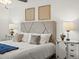 Comfortable main bedroom featuring a plush bed, soft linens, and stylish decor at 7700 W Glasgow Place # 15A, Littleton, CO 80128