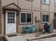 Inviting patio area featuring a grill, seating, and well-maintained exterior details at 7700 W Glasgow Place # 15A, Littleton, CO 80128