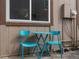 Outdoor patio area featuring a bistro table, chairs, and easy access to the exterior at 7700 W Glasgow Place # 15A, Littleton, CO 80128
