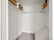 Spacious walk-in closet with shelving and hanging rods for storage at 7700 W Glasgow Place # 15A, Littleton, CO 80128