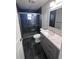 Modern bathroom features stylish tiling, sleek vanity, and glass enclosed shower at 4665 W 6Th Ave # 21, Denver, CO 80204