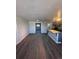 An inviting living area with hardwood flooring and access to the kitchen at 4665 W 6Th Ave # 21, Denver, CO 80204