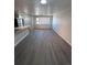 An inviting living area with hardwood flooring and natural light from the window at 4665 W 6Th Ave # 21, Denver, CO 80204