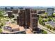 Aerial view of the modern high-rise building with surrounding greenery and cityscape, showcasing its prime location at 8100 E Union Ave # 712, Denver, CO 80237