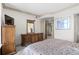 Well-lit bedroom featuring classic furniture, soft carpeting, and ample closet space at 8100 E Union Ave # 712, Denver, CO 80237