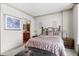Charming bedroom with a cozy bed, bedside tables, and decor at 8100 E Union Ave # 712, Denver, CO 80237