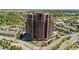 Stunning high-rise residence featuring a brick facade, street-level access, and lush landscaping at 8100 E Union Ave # 712, Denver, CO 80237