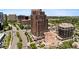 Stunning high-rise building featuring brick facade, ample parking, and lush landscaping at 8100 E Union Ave # 712, Denver, CO 80237
