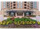 Beautiful building entrance with lush landscaping and a covered walkway for a grand welcome at 8100 E Union Ave # 712, Denver, CO 80237