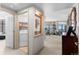 Convenient laundry room with ample storage and a glimpse into the open-concept living space beyond at 8100 E Union Ave # 712, Denver, CO 80237