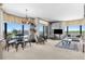 Bright living room boasts expansive windows, stylish furnishings, and an open concept perfect for modern living at 8100 E Union Ave # 712, Denver, CO 80237