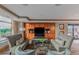 Comfortable lounge area featuring plush seating, a stylish glass coffee table, and built-in shelving for a relaxing space at 8100 E Union Ave # 712, Denver, CO 80237