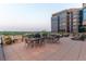 Spacious outdoor patio with dining and lounging furniture, offering serene views of the surrounding landscape at 8100 E Union Ave # 712, Denver, CO 80237