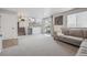 Finished basement area with a cozy sectional sofa, sliding glass door to the backyard, and stairs to the main floor at 11072 Quail Ct, Parker, CO 80134