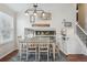 Dining room with a dining table, decorative lighting, decor, and hardwood flooring at 11072 Quail Ct, Parker, CO 80134