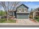 Charming two-story home with blue siding, wood shutters, and an attached two-car garage at 11072 Quail Ct, Parker, CO 80134