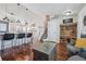 Open-concept living room with hardwood floors, modern decor, and seamless kitchen access at 11072 Quail Ct, Parker, CO 80134