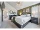 A charming main bedroom with a vaulted ceiling, an accent wall, and decorative lighting at 11072 Quail Ct, Parker, CO 80134