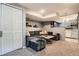 Finished basement with a large sectional, comfortable seating, and a stylish entertainment area at 300 S Lincoln St, Denver, CO 80209