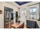 Charming kitchen boasts stainless steel appliances, hardwood floors, and a bright window view at 300 S Lincoln St, Denver, CO 80209