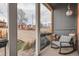 Cozy covered porch with rocking chair and a view of the landscaped yard at 300 S Lincoln St, Denver, CO 80209