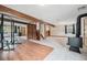 Large basement area perfect for a gym or recreational space, featuring tile floors and a wood-burning stove at 10858 Norton Ave, Conifer, CO 80433