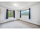 Spacious bedroom with large windows offering views of the surrounding greenery at 10858 Norton Ave, Conifer, CO 80433