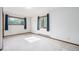 Bright bedroom featuring natural light from two windows and neutral carpeting at 10858 Norton Ave, Conifer, CO 80433