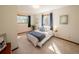 Cozy bedroom with carpet, light walls, windows dressed with blue curtains, and a comfy bed at 10858 Norton Ave, Conifer, CO 80433